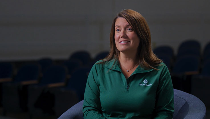 Susan Gleason of Heartland Credit Union sits in a chair speaking to the camera during an interview.